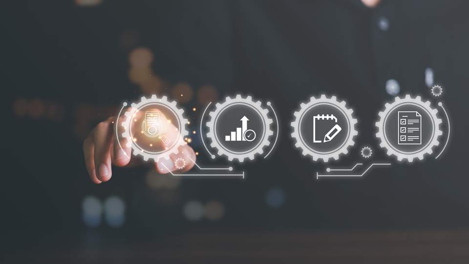 Visual of a person pointing at gears with statistics and data.